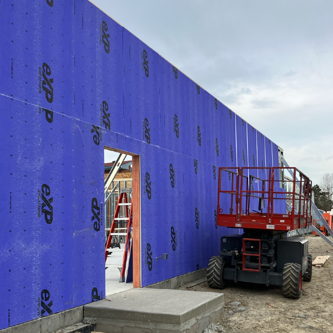 Photo of wall with sheets of insulation