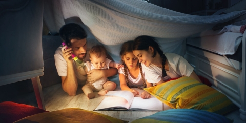 Family reading a bedtime story stock imagery
