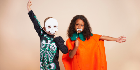 Two children in halloween costumes