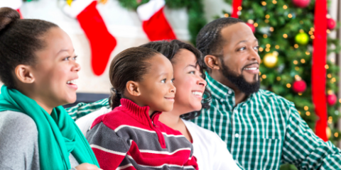 family enjoying a christmas movie