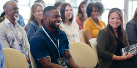 Conference room with smiling attendees