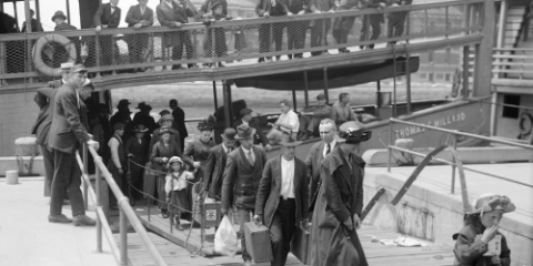 old photograph of travelers getting off of a boat
