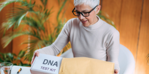 photo of senior opening a DNA test kit